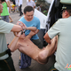 Illustration for article titled Naked Man Meditates in Busy Chinese Street
